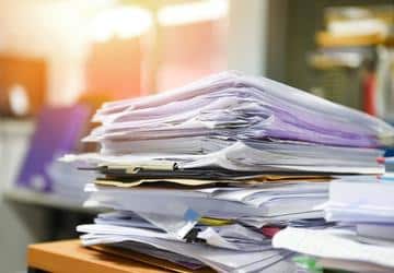 A stack of papers on a desk