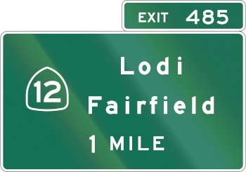 A green interstate sign that reads "Lodi Fairfield 1 MILE"